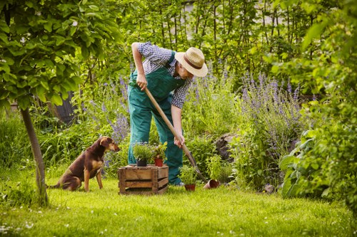 Gardener tending to plants in Blackfriars
